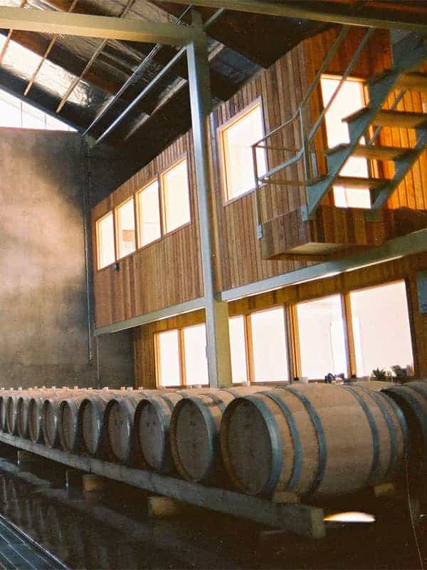 Interior of Cloudy Bay's Marlborough winery with large wine barrels