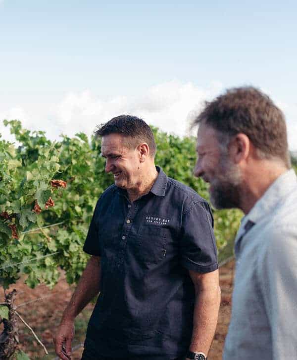 Viticultirst John Flanagan and estate director Jim White looking at a grapevine