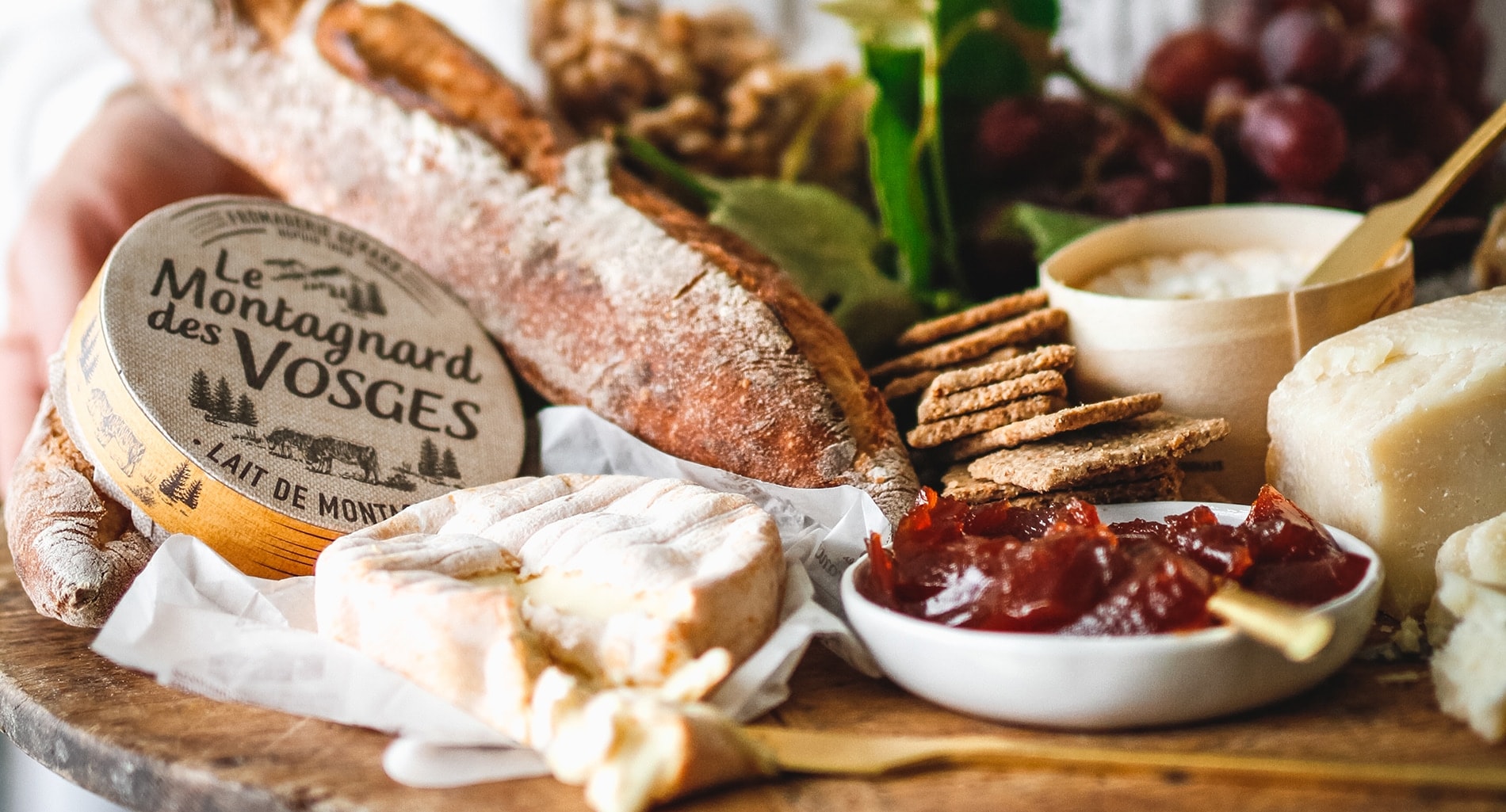 A platter, with cheese, charcuterie and bread