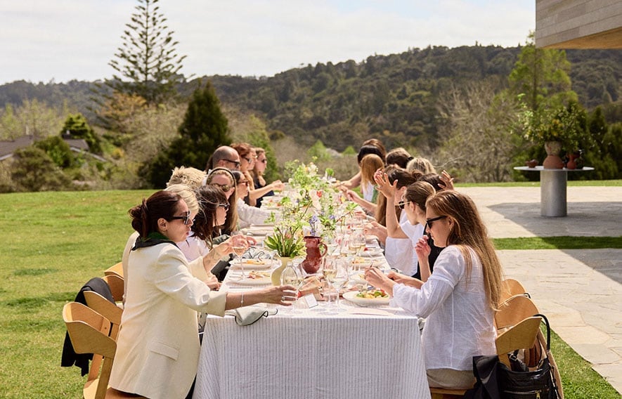 Desktop banner image showing the Wonderscape NZ 2023 event with a group of people attending a long lunch