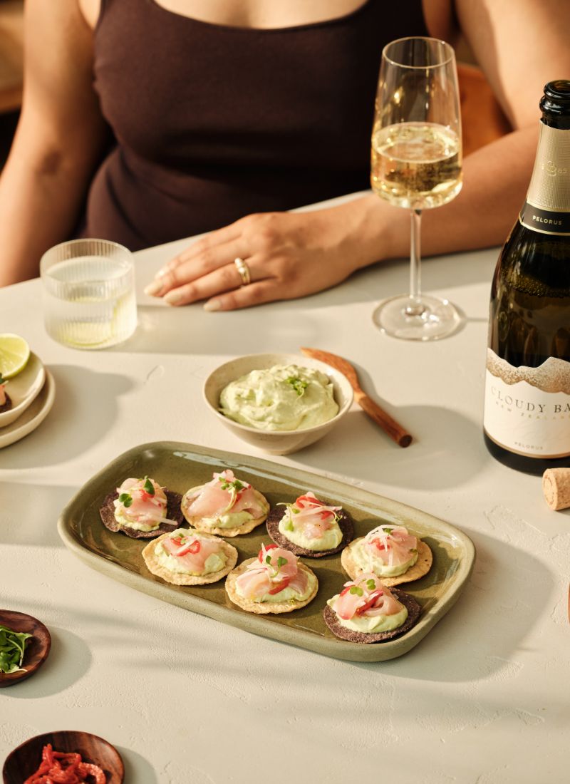 A bottle of Pelorus with a recipe to pair
