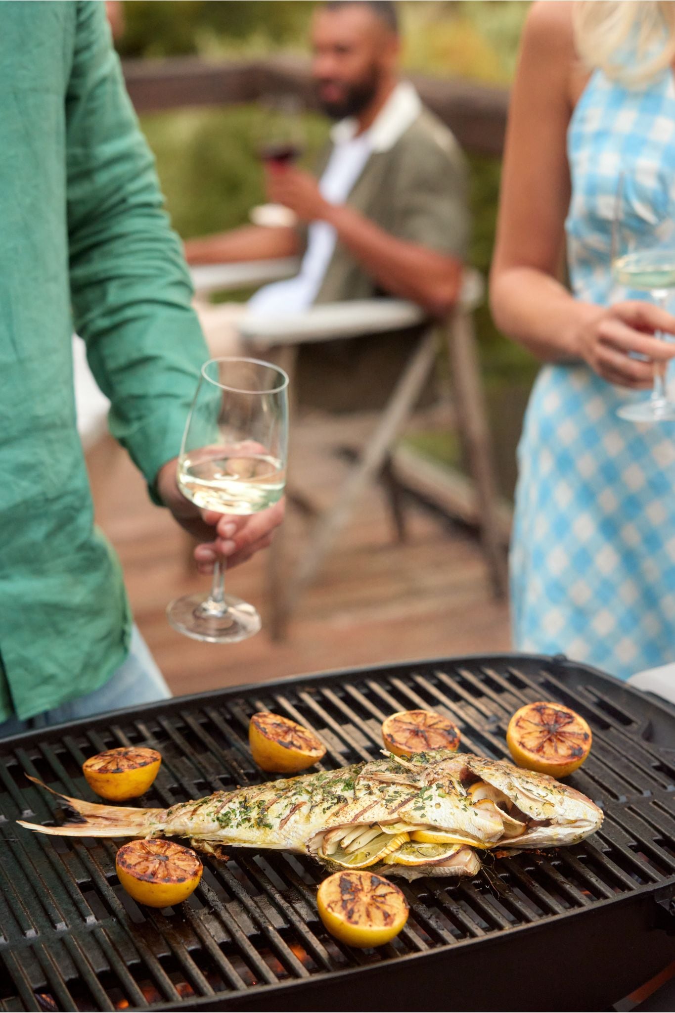 grilled fish and lemons on bbq