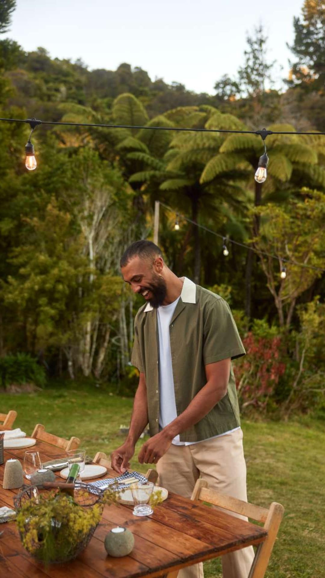 someone setting the table outside