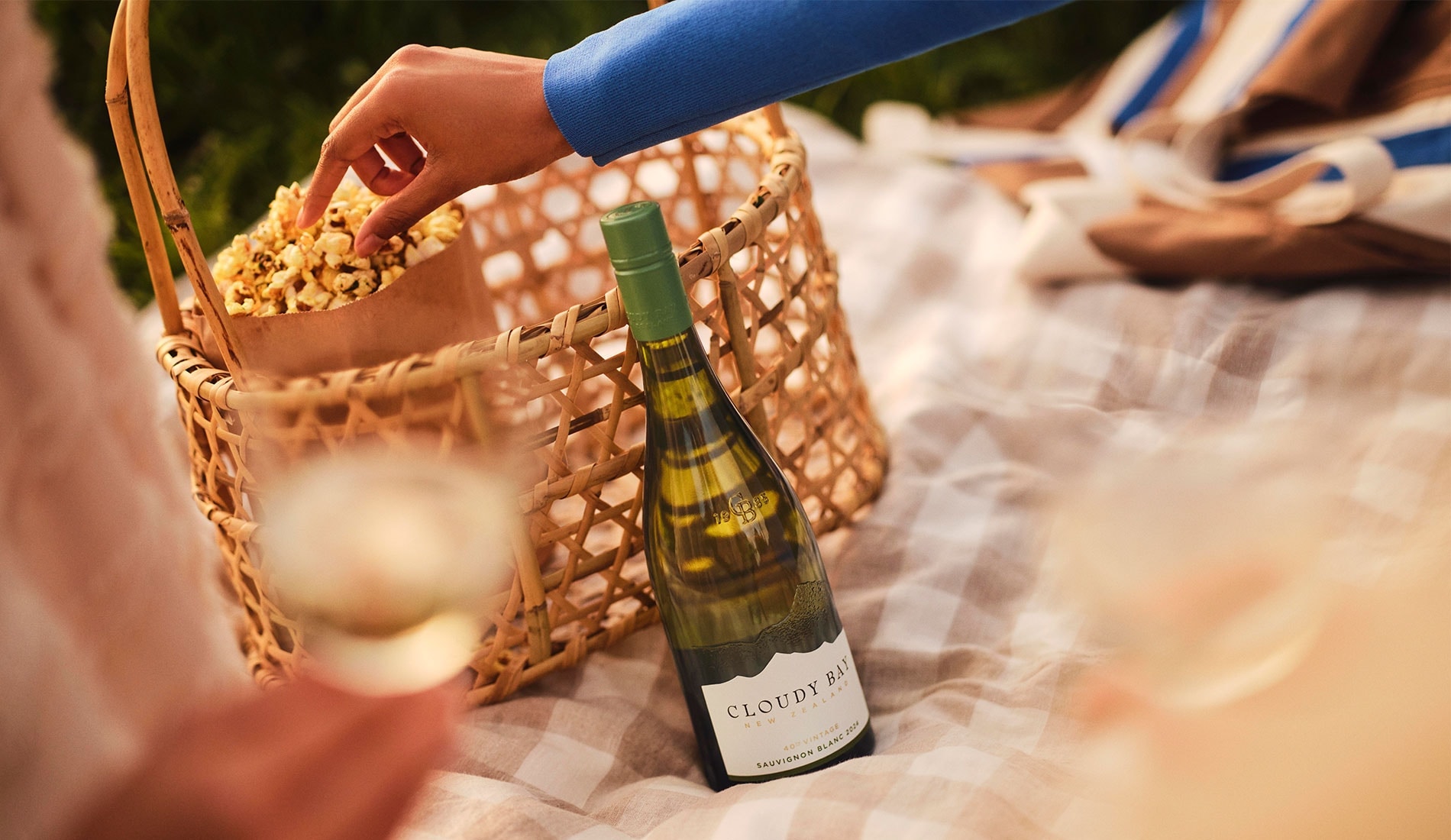 Picnic basket with popcorn and Cloudy Bay Sauvignon Blanc