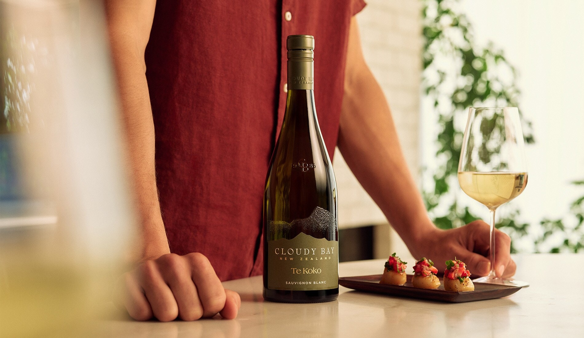 Bottle of Te Koko with grilled Scallop Bites