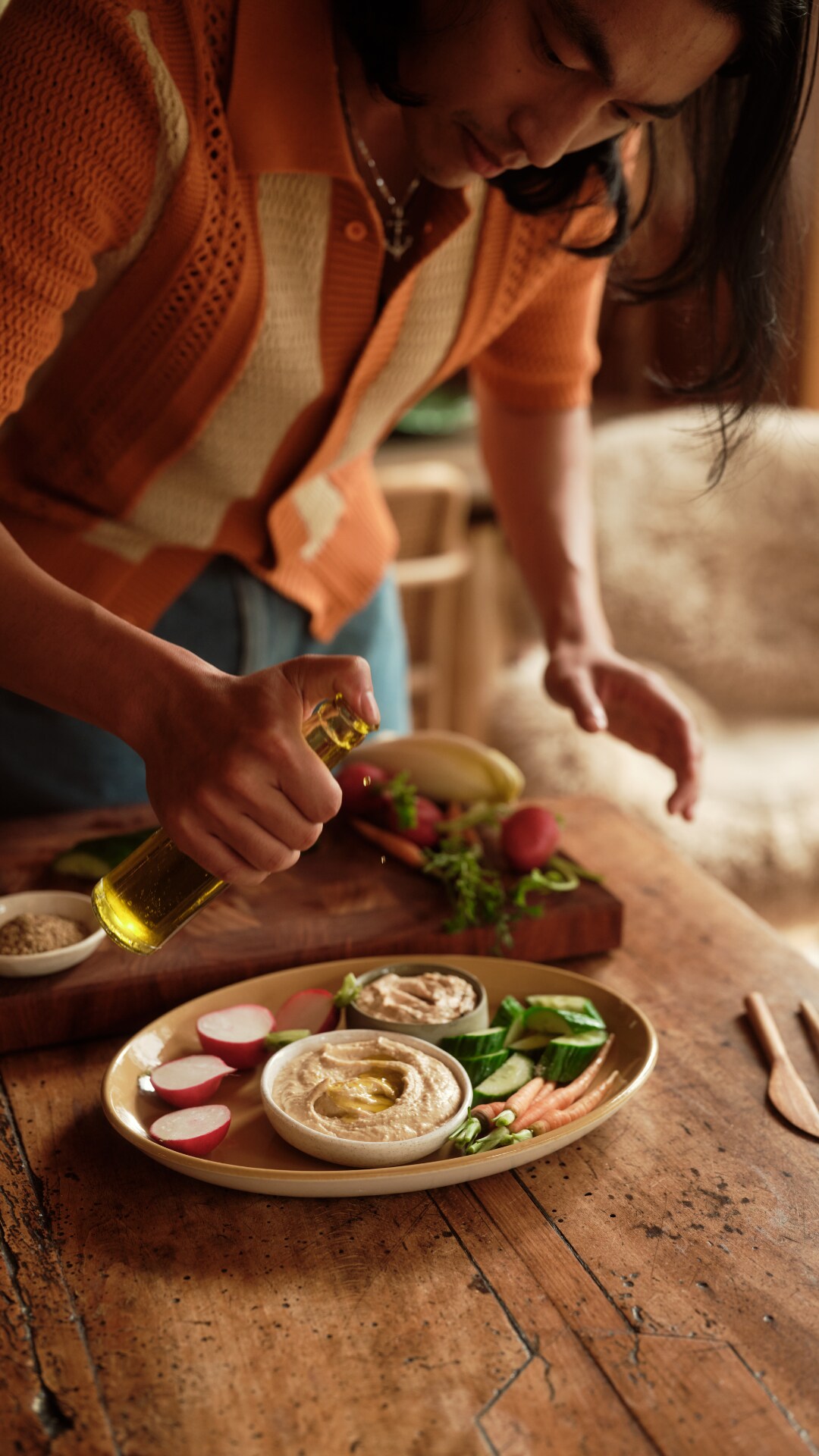 pouring olive oil on platter