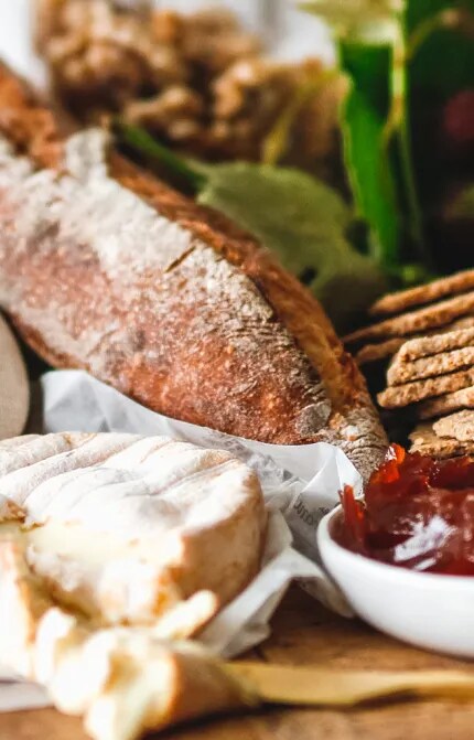 A platter, with cheese, charcuterie and bread