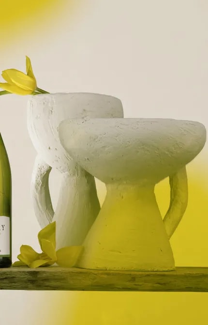 Desktop banner image showing bottle of Sauvignon Blanc 2023 with yellow flowers