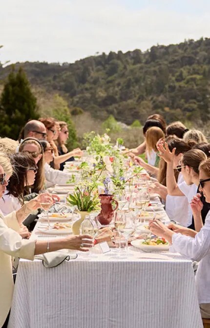 Desktop banner image showing the Wonderscape NZ 2023 event with a group of people attending a long lunch