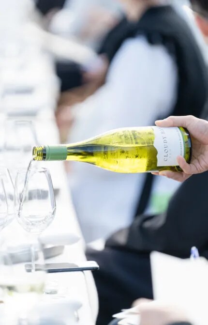cloudy bay wine being poured