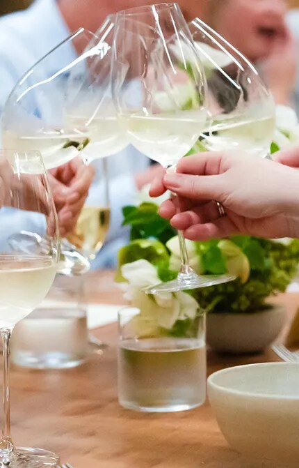 cheersing at table