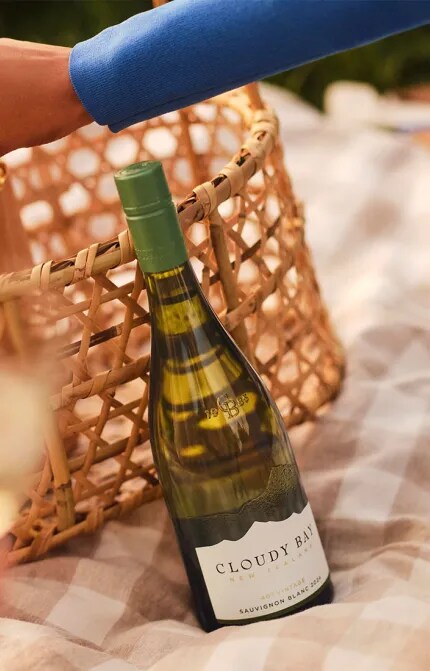 Picnic basket with popcorn and Cloudy Bay Sauvignon Blanc