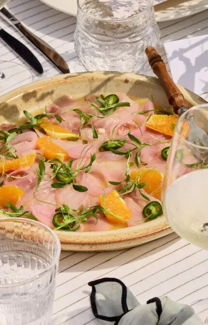 kingfish crudo on table